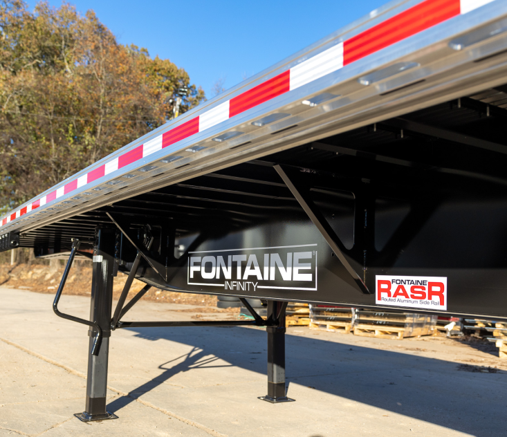 A close-up view of a Fontaine Infinity trailer showcasing its structural details and branding.